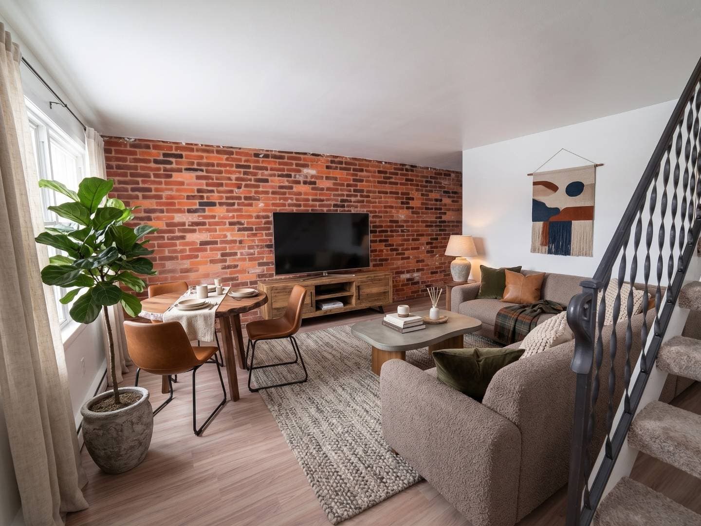 Living room and stairs in a Brookville townhome